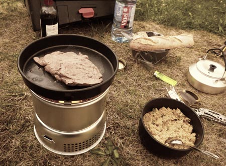 Camping stove cooking steak and couscous