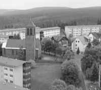 Elevated view of the church at Oberhof, surrounded by grey communist residential blocks